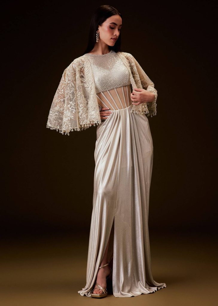 Off White Corset Gown With Sheer Waistline And Embroidered Cape

